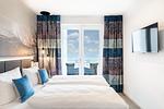 Schlafzimmer 2 mit Zugang zum Balkon - Apartmentanlage Meerblickvilla 2-25 - Top-Hundeurlaub