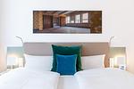 Wohn-/Schlafbereich mit Boxspringbett - Ferienapartments am Krusespeicher 2-23 - Top-Hundeurlaub