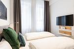 Schlafzimmer mit Boxspringbett - Ferienapartments am Krusespeicher 1-09 - Top-Hundeurlaub