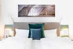 Wohn-/Schlafbereich mit Boxspringbett - Ferienapartments am Krusespeicher 3-26 - Top-Hundeurlaub