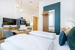 Wohn-/Schlafbereich mit Flatscreen-TV - Ferienapartments am Krusespeicher 3-29 - Top-Hundeurlaub