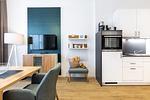 Wohn-/Schlafbereich mit Flatscreen-TV - Ferienapartments am Krusespeicher 3-33 - Top-Hundeurlaub