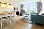 Wohn-Essbereich mit Couch und Esstisch - Seehof 224 - Top-Hundeurlaub