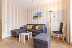 Wohn-Essbereich mit Couch - Meeresblick 219 - Top-Hundeurlaub