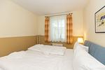 Schlafzimmer mit Doppelbett - Meeresblick 219 - Top-Hundeurlaub