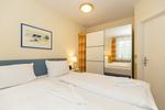 Schlafzimmer mit Doppelbett - Meeresblick 219 - Top-Hundeurlaub