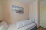 Schlafzimmer mit Einzelbett - Hus Inselkieker 221 - Top-Hundeurlaub