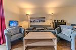 Wohn-Essbereich mit Couch - Resort Deichgraf 27-09 - Top-Hundeurlaub