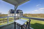 Überdachter Balkon mit Sitzgelegenheit - Resort Deichgraf 31-06 - Top-Hundeurlaub