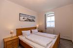 Schlafzimmer mit Doppelbett - Apartment-Residenz Ostseestrand 34 - Top-Hundeurlaub