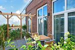 Terrasse mit seitlichem Blick aufs Meer - Aparthotel Anna Düne 0-01 - Top-Hundeurlaub