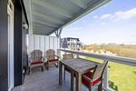 Balkon mit Gartenmöbel und Ausblick - Resort Deichgraf 31-13 - Top-Hundeurlaub
