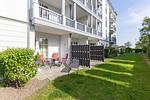 Terrasse mit Gartenmöbeln und Grünfläche - Apartmenthaus Atlantik 006 - Top-Hundeurlaub