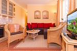 Wohn-Essbereich mit Couch - Dünenschloss 1-33 - Top-Hundeurlaub