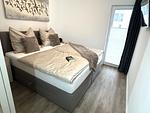 2. Schlafzimmer mit Boxspringbett und TV - Graftblick am Meer (48.0.S) - Top-Hundeurlaub