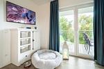 Wohnzimmer mit großem TV und Hundeplatz - Ankerplatz (47.2.S) - Top-Hundeurlaub
