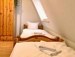 Schlafzimmer mit 2 Einzelbetten - Hafenhäuser Breege - Ferienwohnung 18 "Ankerplatz" - Top-Hundeurlaub