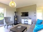 Ferienwohnung Strandflair Ostseebad Wustrow ZweiWasser Alte Seefahrtschule Gemütlicher Wohnbereich mit Kamin - Strandflair - Top-Hundeurlaub