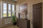 Ferienwohnung Sonnengott in Wustrow - Blick in den Eingang mit Garderobe und Schuhschrank - Sonnengott - Top-Hundeurlaub