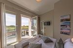 Ferienwohnung Sonnengott in Wustrow - Schlafzimmer mit Balkonzugang - Sonnengott - Top-Hundeurlaub