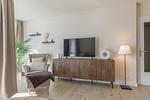 Ferienwohnung Küstenglück Aparthotel Zingst - Tv und Sessel im Wohnbereich - Küstenglück - Top-Hundeurlaub