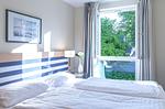 Ferienwohnung Bernsteinwind in Zingst - Schlafzimmer Bett - Bernsteinwind - Top-Hundeurlaub