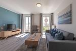 Ferienwohnung Ostseesonne Zingst - Blick ins Wohnzimmer mit Tv und Couch - Ostseesonne - Top-Hundeurlaub