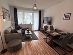 Nordlicht Ferienwohnung Wohnzimmer - Ferienwohnung NORDLICHT mit Balkon und Infrarotsauna - Top-Hundeurlaub
