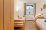 Schlafzimmer - Ferienwohnung Auszeit nur 100 m zum Strand mit Balkon - Top-Hundeurlaub