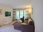 Wohnzimmer - Komfortplus Ferienwohnung mit 1 Schlafzimmer und Terrasse (035) - Top-Hundeurlaub