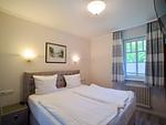 Schlafzimmer - Komfortplus Ferienwohnung mit 1 Schlafzimmer und Terrasse (035) - Top-Hundeurlaub