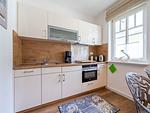 Küche / Küchenzeile - Komfortplus Ferienwohnung mit 1 Schlafzimmer und Balkon im Obergeschoss (046) - Top-Hundeurlaub