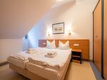 Schlafzimmer - Klassik Ferienwohnung mit 1 Schlafzimmer und Balkon im Dachgeschoss (160) - Top-Hundeurlaub