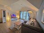 Wohnzimmer - Komfortplus Ferienwohnung mit 1 Schlafzimmer und Balkon im Dachgeschoss (184) - Top-Hundeurlaub