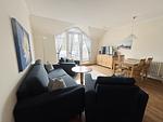 Wohnzimmer - Komfortplus Ferienwohnung mit 1 Schlafzimmer und Balkon im Dachgeschoss (247) - Top-Hundeurlaub