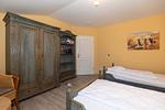 Schlafzimmer mit zwei Einzelbetten - Apartmenthaus Atlantik 411 - Top-Hundeurlaub