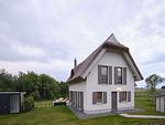 Hauptansicht - LuxusPlus Reetdachvilla mit 4 Schlafzimmern, Außensauna, Loungebereich und Kamin (H06) - Top-Hundeurlaub