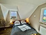 Schlafzimmer mit Doppelbett - Haus Ostseewelle - Top-Hundeurlaub