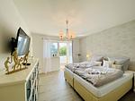 Schlafzimmer - Ferienwohnung Weltenbummler 18 Haus Strandbummler Baabe - Top-Hundeurlaub