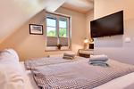 Schlafzimmer - Ferienhaus Boddenbrise 13 Feriendorf Klein Stresow Rügen - Top-Hundeurlaub