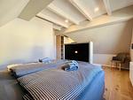 Schlafzimmer - Ferienhaus Seeblick 19 Feriendorf Klein Stresow Rügen - Top-Hundeurlaub