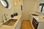 Küche / Küchenzeile - Ferienwohnung Lotsenloft 16 im Haus Düne 7 - Top-Hundeurlaub