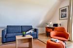Wohnzimmer - Ferienwohnung Buntspecht 31 im Wreecher Idyll Rügen - Top-Hundeurlaub