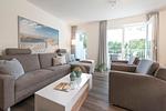 Wohn-Essbereich mit Couch - NordseeResort Friesland 38 - Top-Hundeurlaub