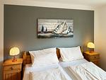 Schlafzimmer in der Ferienwohnung Üüs Aran 4 in Süddorf auf Amrum - Ferienwohnung *Üüs Aran 4* - Top-Hundeurlaub