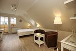 Wohnzimmer mit Sitzecke - Wohnung 10 - Top-Hundeurlaub