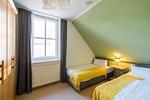 Schlafzimmer mit zwei Einzelbetten - Haus am Schilf - Wohnung 7 - Top-Hundeurlaub