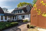 Außenansicht eines Wellnessgebäudes mit Sauna - Haus am Schilf - Wohnung 1 - Top-Hundeurlaub