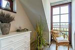 Balkon mit Pflanzen und gemütlichem Stuhl - Nele Nelsson Hus, Landhaus Haven Höövt - Top-Hundeurlaub