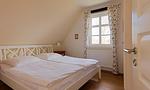 Gemütliches Schlafzimmer mit zwei Einzelbetten - Klönhus - Top-Hundeurlaub